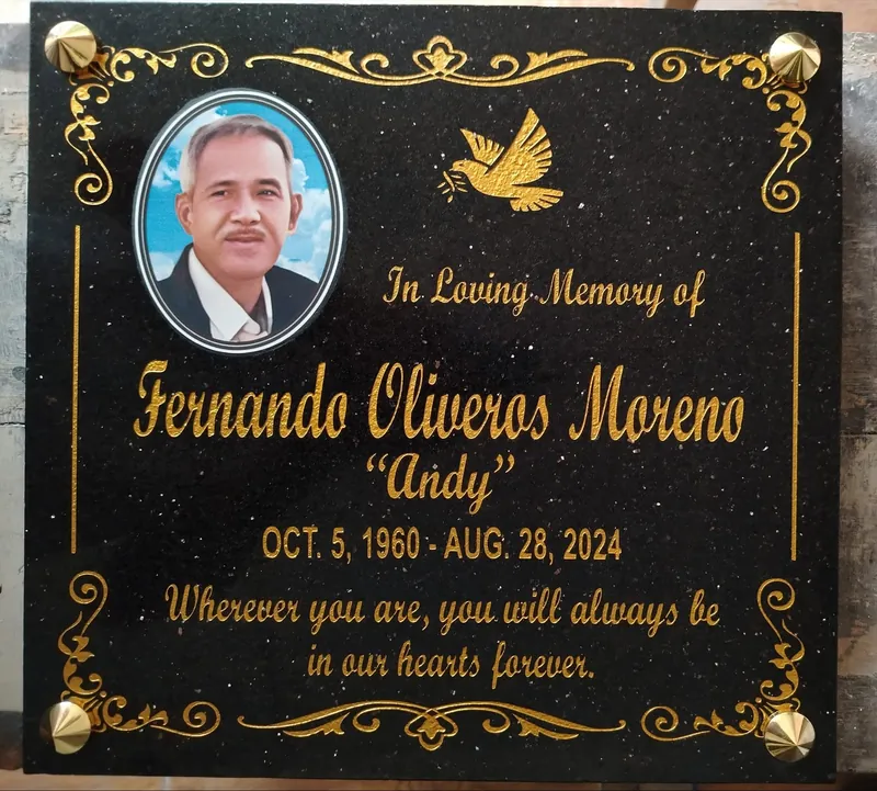 Black galaxy granite lapida with gold script lettering, dove engraving, gold border and brass standoff fittings